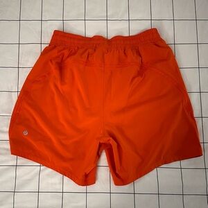 Lululemon Pace Breaker Linerless Short 7” in Solar Orange